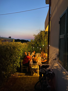 Photo of our family dinner at my Airbnb at night during the visit.