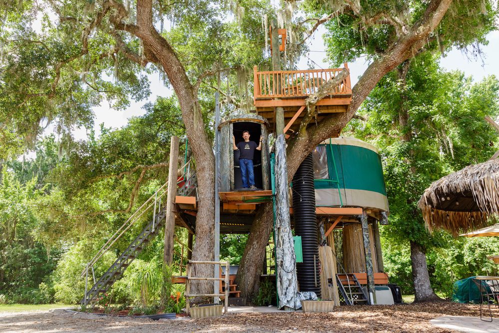Author Joseph Michelli explores the treehouse at Danville, a collection of Airbnb listings in Geneva, Florida. Photo credit: Steven Miller Photography, Steven Miller