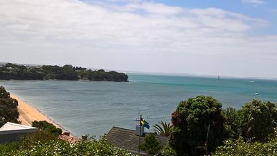 Swedish Flag overlooking Cheltenham Beach, Auckland