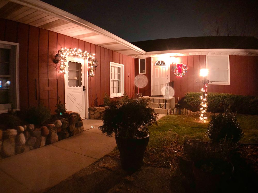 Exterior entrance to Efficiency Unit 2 (garland  over the door)