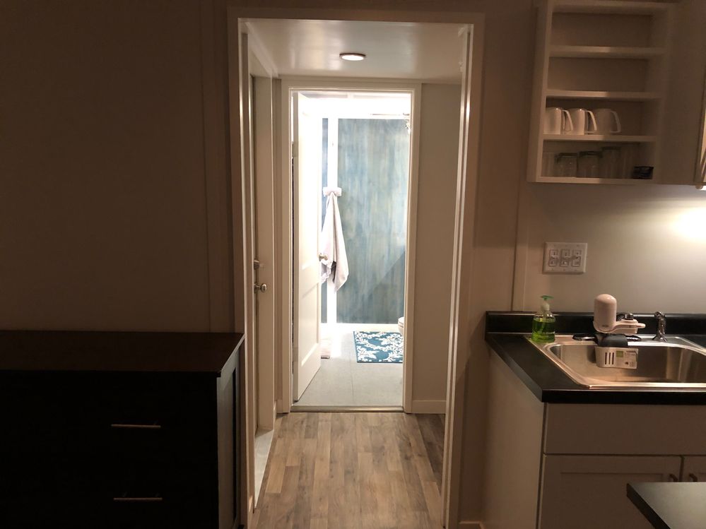 bathroom  hallway and  door to laundry room