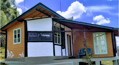 This is Xainã, built with wood from reforestation, adobe (an unbaked handmade brick), demolition windows and doors and ecological tile.