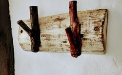 Towel rack made out of bark and bracnches