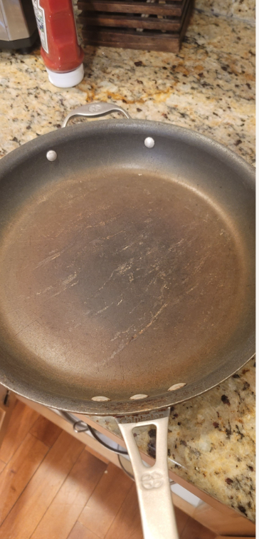 These pans should be replace. You can get a great pan that will last for a long time for $15-$20 at Home Goods